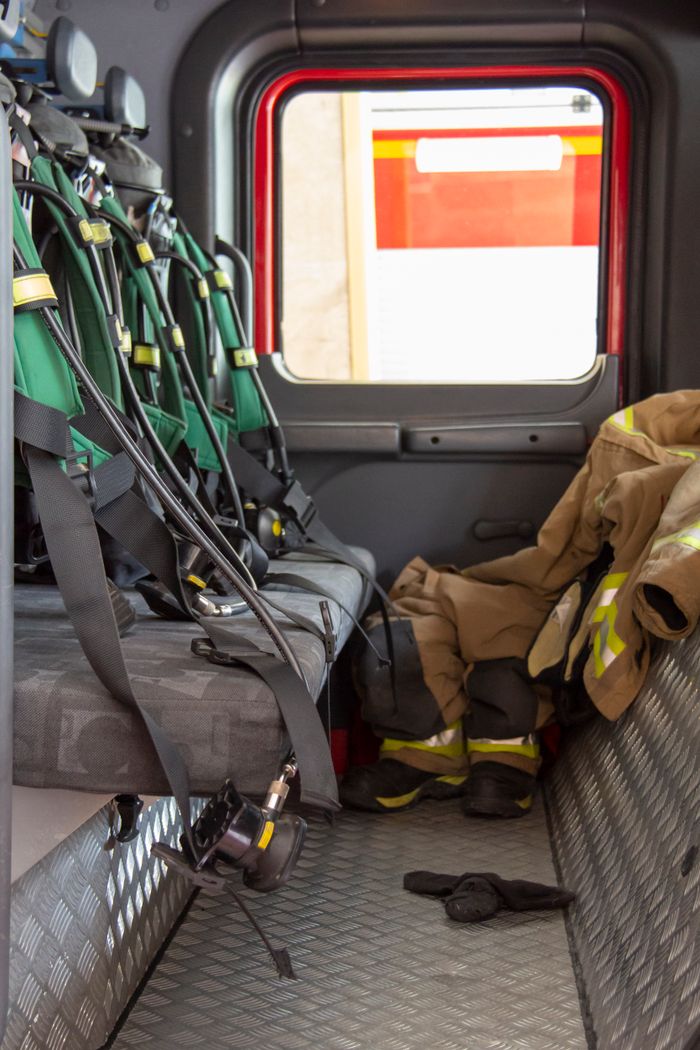 Interior view of a fire truck in Tehran showcasing gear and equipment used by firefighters.